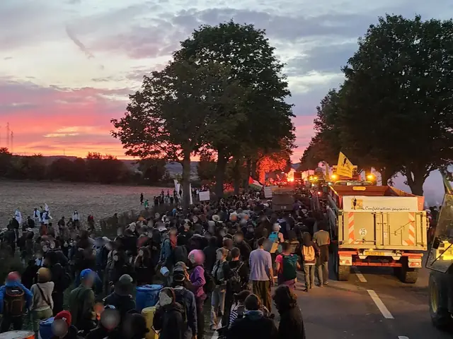 The convoy heads back towards Gaillon under a pink sunset, followed by the tractors